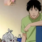Một nhân vật từ anime Welcome to the NHK, khắc họa nỗi cô lập xã hội và đấu tranh tâm lý.