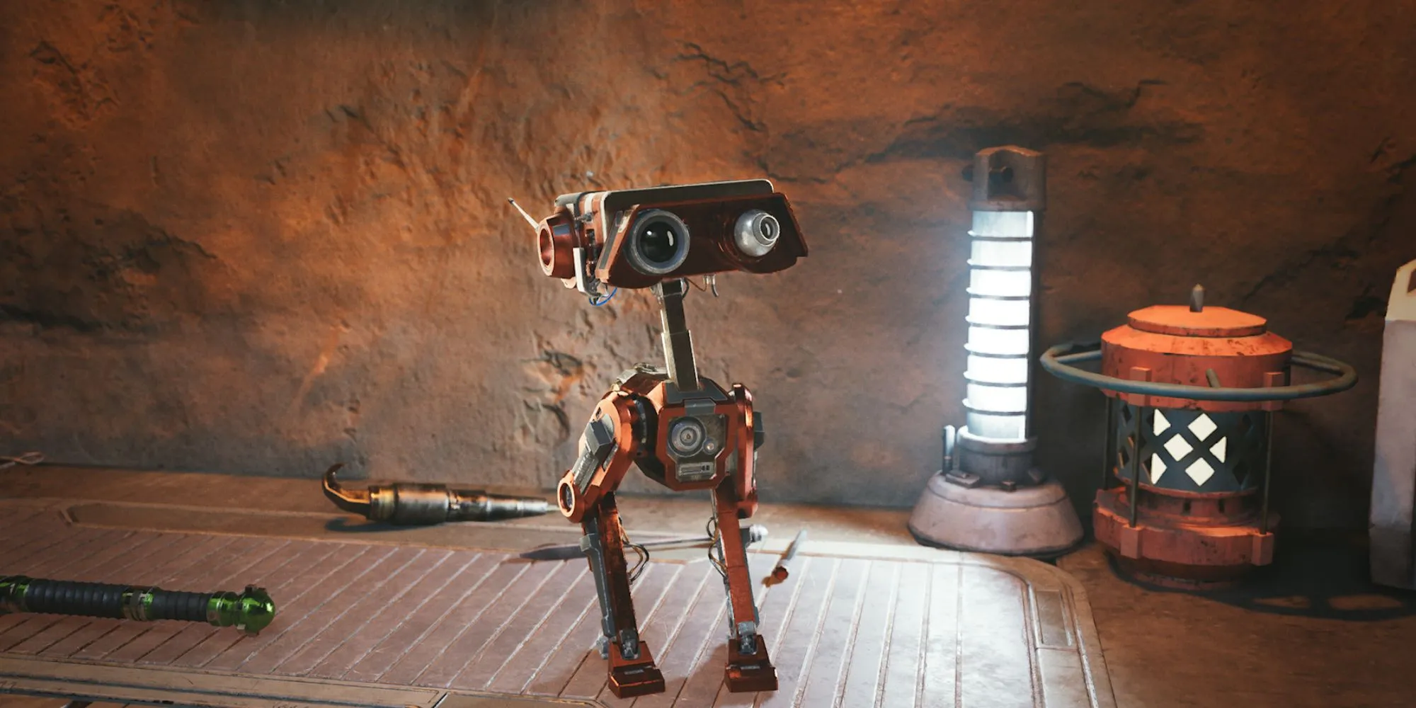 Droid BD-1 dễ thương trong Star Wars Jedi Survivor đang được Cal Kestis bảo trì trên bàn làm việc