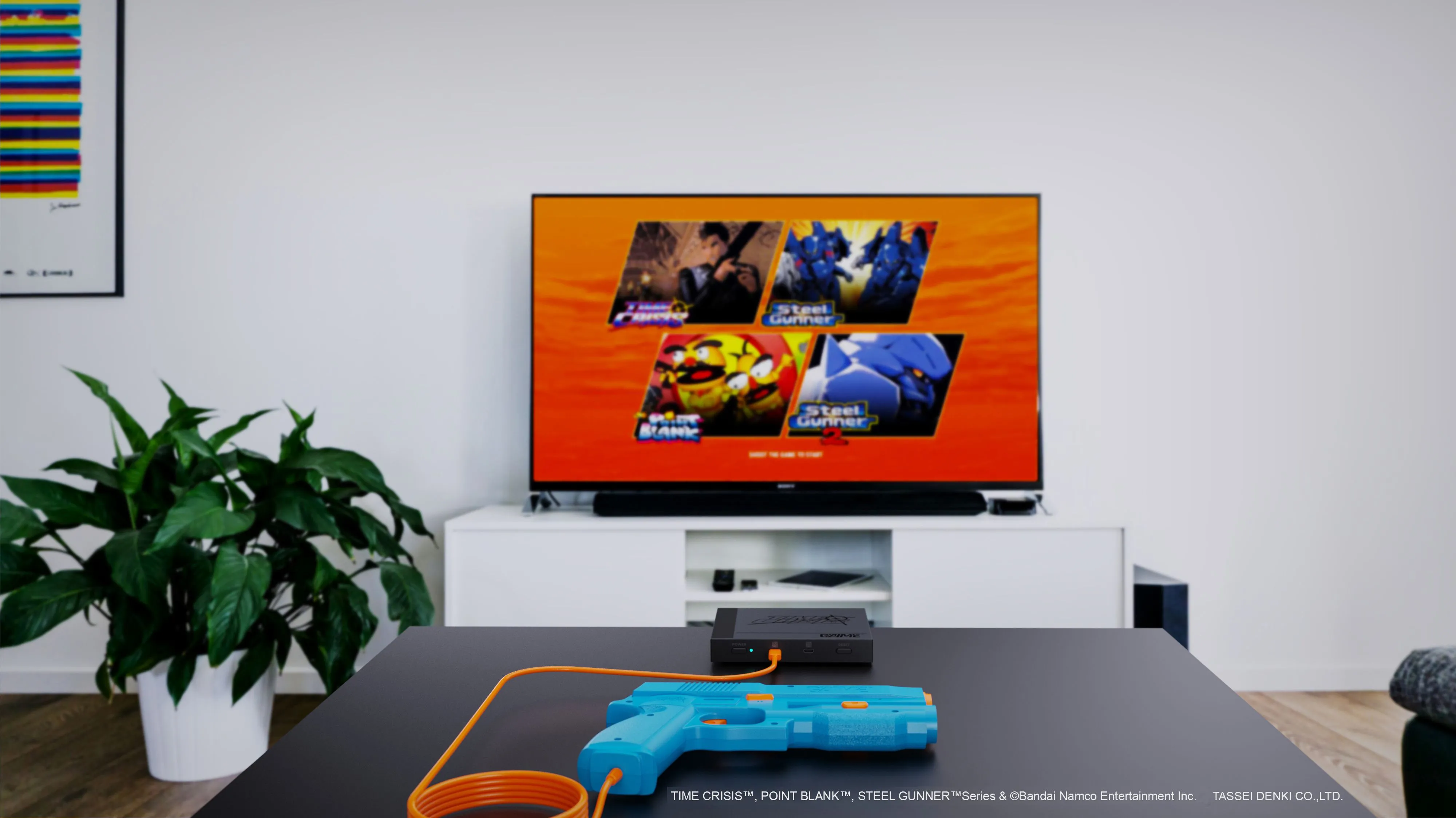 Hệ thống súng chơi game G'aim'e Plug & Play được thiết lập trước màn hình TV hiện đại, sẵn sàng cho trải nghiệm bắn súng arcade tại nhà.